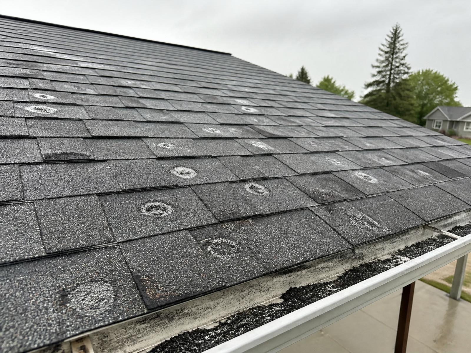 Storm-damaged roof before restoration